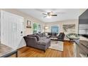 Cozy living room with hardwood floors, large sectional couch, and abundant natural light at 1736 23Rd N Ave, St Petersburg, FL 33710
