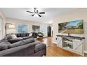 Comfortable living room featuring hardwood floors and a large sectional couch at 1736 23Rd N Ave, St Petersburg, FL 33710