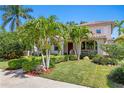 Home displaying well-manicured landscaping and a cozy front porch at 2421 Brevard Ne Rd, St Petersburg, FL 33704