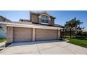 Spacious three-car garage perfect for storing vehicles and outdoor equipment at 2629 Timacqua Dr, Holiday, FL 34691