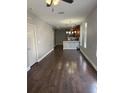 Open concept living area leading to the kitchen with hardwood flooring and natural light at 2903 N 16Th St, Tampa, FL 33605