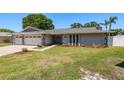 Well maintained home with manicured lawn and landscaping at 3241 Brushwood Ct, Clearwater, FL 33761