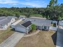 Aerial view of a single-story home with solar panels and fenced yard at 512 Red Mangrove Ln, Apollo Beach, FL 33572