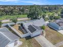Aerial view of a single-story home featuring solar panels and fenced yard at 512 Red Mangrove Ln, Apollo Beach, FL 33572