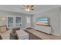 Bright living room showcasing a comfortable sofa, stylish decor, and a large window offering plenty of natural light at 5591 15Th N Ave, St Petersburg, FL 33710