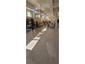 View of the community lobby with tile floors, neutral decor, and ample seating at 701 S Madison Ave # 316, Clearwater, FL 33756