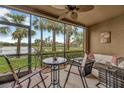 Covered patio with furniture that overlooks the water and has an outdoor ceiling fan at 7339 Skybird Rd # 7339, Bradenton, FL 34209