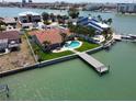 Beautiful waterfront property with a private pool, dock, and lush landscaping at 8053 13Th S Ave, St Petersburg, FL 33707