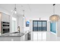 Bright, modern kitchen features a large island, stainless appliances, and stylish pendant lighting at 100 1St N Ave # 3104, St Petersburg, FL 33701