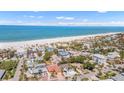 Stunning aerial view of the home and neighborhood, showcasing proximity to the beach and the Gulf at 1008 Mandalay Ave, Clearwater, FL 33767