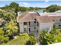 Aerial view of the condo building showcasing its proximity to a beautiful, serene lake at 108 Lakeview Ct # 108, Oldsmar, FL 34677