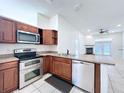 Well-equipped kitchen with stainless steel appliances and ample cabinet space at 11535 Wellman Dr, Riverview, FL 33578