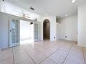 Bright living room with neutral walls and tile flooring throughout the house at 11535 Wellman Dr, Riverview, FL 33578