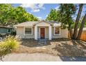 Charming bungalow featuring a well-kept front yard and inviting entryway at 1219 Michigan N Dr, Dunedin, FL 34698