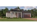 Charming one-story home with a covered entry, a well-maintained lawn, and a two-car garage at 31556 Cardinal Yard Dr, San Antonio, FL 33576