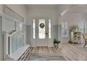 Bright foyer with stylish bench and decorative accents creating a warm welcome at 718 Manns Harbor Dr, Apollo Beach, FL 33572