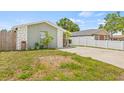 Charming single-story home with a well-maintained lawn and beautiful stone accents at 9112 Suffield Ct, Tampa, FL 33615
