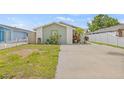 Charming single-story home with a well-maintained lawn and beautiful stone accents at 9112 Suffield Ct, Tampa, FL 33615