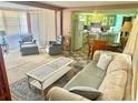 Inviting living room with plush seating, neutral tones, and open access to the kitchen at 9790 66Th N St # 80, Pinellas Park, FL 33782