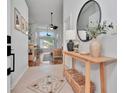 Inviting entryway featuring tile flooring, modern decor, and seamless flow into the adjacent living areas at 12327 Glenfield Ave, Tampa, FL 33626