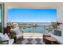 Relaxing balcony with comfortable seating and a beautiful view of the bay and waterfront at 1325 Snell Isle Ne Blvd # 911, St Petersburg, FL 33704