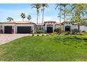Charming home with a paver driveway, three-car garage, and well-maintained lawn at 2012 Carolina Ne Cir, St Petersburg, FL 33703