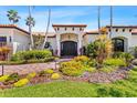 Inviting front entrance with a paver walkway, beautiful landscaping, and a dark wood front door at 2012 Carolina Ne Cir, St Petersburg, FL 33703