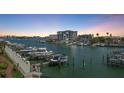 Waterfront condo building with marina and boat docks on scenic waterway at 202 Windward Psge # 304, Clearwater Beach, FL 33767