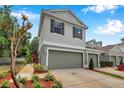 Inviting two-story townhome boasting an attached garage and beautifully landscaped front yard at 2531 Earlswood Ct, Brandon, FL 33510