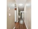 Hallway view featuring wood floors, and neutral paint at 256 Castlekeeper Pl, Valrico, FL 33594