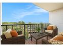 Relaxing balcony with seating and stunning ocean views perfect for enjoying coastal living at 2699 Seville Blvd # 705, Clearwater, FL 33764