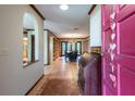 Inviting foyer with a view into a dining room with built-in shelving at 4215 Water Oaks Ln, Tampa, FL 33618