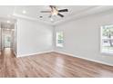 Spacious bedroom with wood flooring, recessed lighting, a ceiling fan, and large windows at 4568 18Th S Ave, St Petersburg, FL 33711