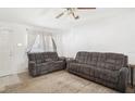 Bright living room featuring comfortable seating, neutral tones, and a cozy ambiance at 8004 N Brooks St, Tampa, FL 33604