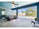 Inviting outdoor patio with comfortable seating and a view of the pool at 11852 Lake Lucaya Dr, Riverview, FL 33579