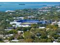 Stunning aerial view showcasing the waterfront community near a baseball stadium, offering scenic views and recreational opportunities at 1276 Bertland Way, Clearwater, FL 33755