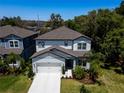 Charming two-story home with a manicured lawn and two car garage in a desirable neighborhood at 14146 Samoa Hill Ct, Riverview, FL 33569