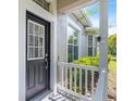 Inviting front entrance with a decorative door and manicured landscaping at 20113 Bending Creek Pl, Tampa, FL 33647