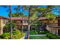 Beautiful condo featuring well-kept grounds, wood balconies and a serene setting at 2693 Sabal Springs Cir # 206, Clearwater, FL 33761