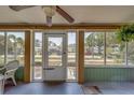 Enclosed front porch with ceiling fan and views of the neighborhood at 2835 Dartmouth N Ave, St Petersburg, FL 33713