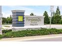 A detailed image of the Persimmon Park at Wiregrass Ranch community sign with landscaping around the sign at 28680 Cozy Creek Dr, Wesley Chapel, FL 33543