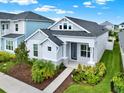 Beautiful single-Gathering home with a modern design, landscaped garden, and a welcoming entrance at 28680 Cozy Creek Dr, Wesley Chapel, FL 33543