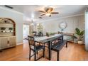 Open-concept dining space with stylish furniture, natural light, and seamless flow to the living room for easy entertaining at 34 Hickory Ln, Safety Harbor, FL 34695