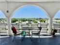 Inviting balcony with seating, offering a peaceful outdoor space with a scenic neighborhood view at 5501 80Th N St # 509, St Petersburg, FL 33709