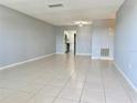 Bright living room with tile floors offering an easy flow into the kitchen at 5501 80Th N St # 509, St Petersburg, FL 33709