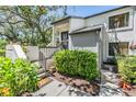 Charming townhouse with lovely landscaping around front entry and stairs at 11450 Harbor Way # 5008, Largo, FL 33774
