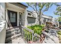 Charming townhouse with stairs, landscaping and shade trees around front entry at 11450 Harbor Way # 5008, Largo, FL 33774
