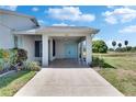 Spacious carport providing sheltered parking and easy access to the front entrance at 2313 Grenoble Pl # 2313, Sun City Center, FL 33573