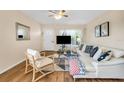 Bright living room featuring hard wood floors, modern furnishings, and ample natural light at 2458 Columbia Dr E # 84, Clearwater, FL 33763