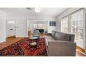Bright living room with hardwood floors, a patterned rug, and modern furniture at 246 20Th Ne Ave, St Petersburg, FL 33704